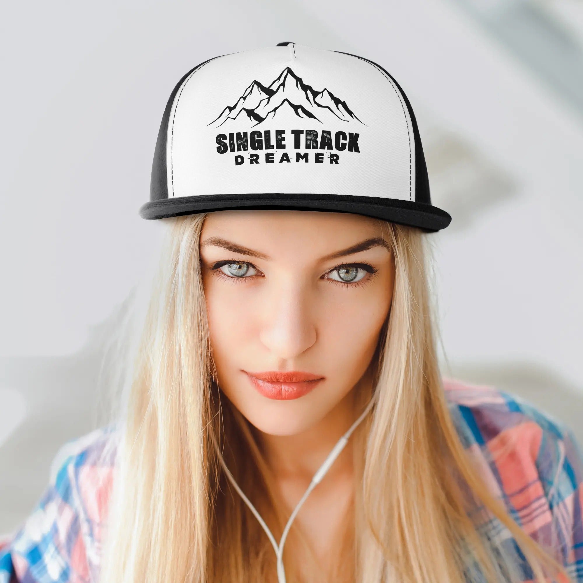 a woman wearing a white and black trucker hat