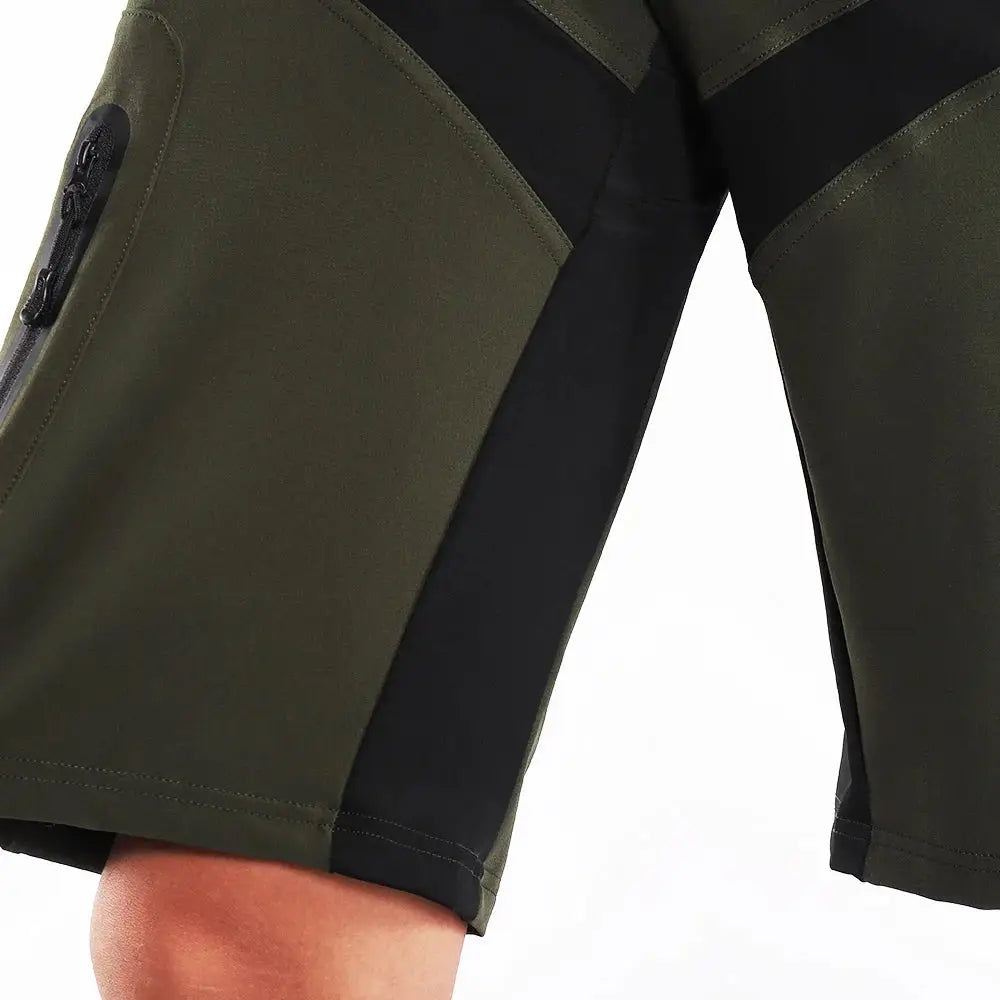 a close up of a person wearing a green and black shorts