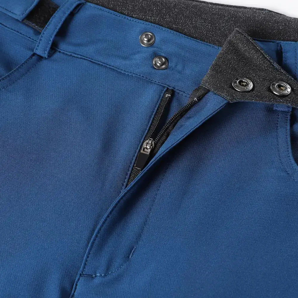 a close up of a blue pants with a zipper